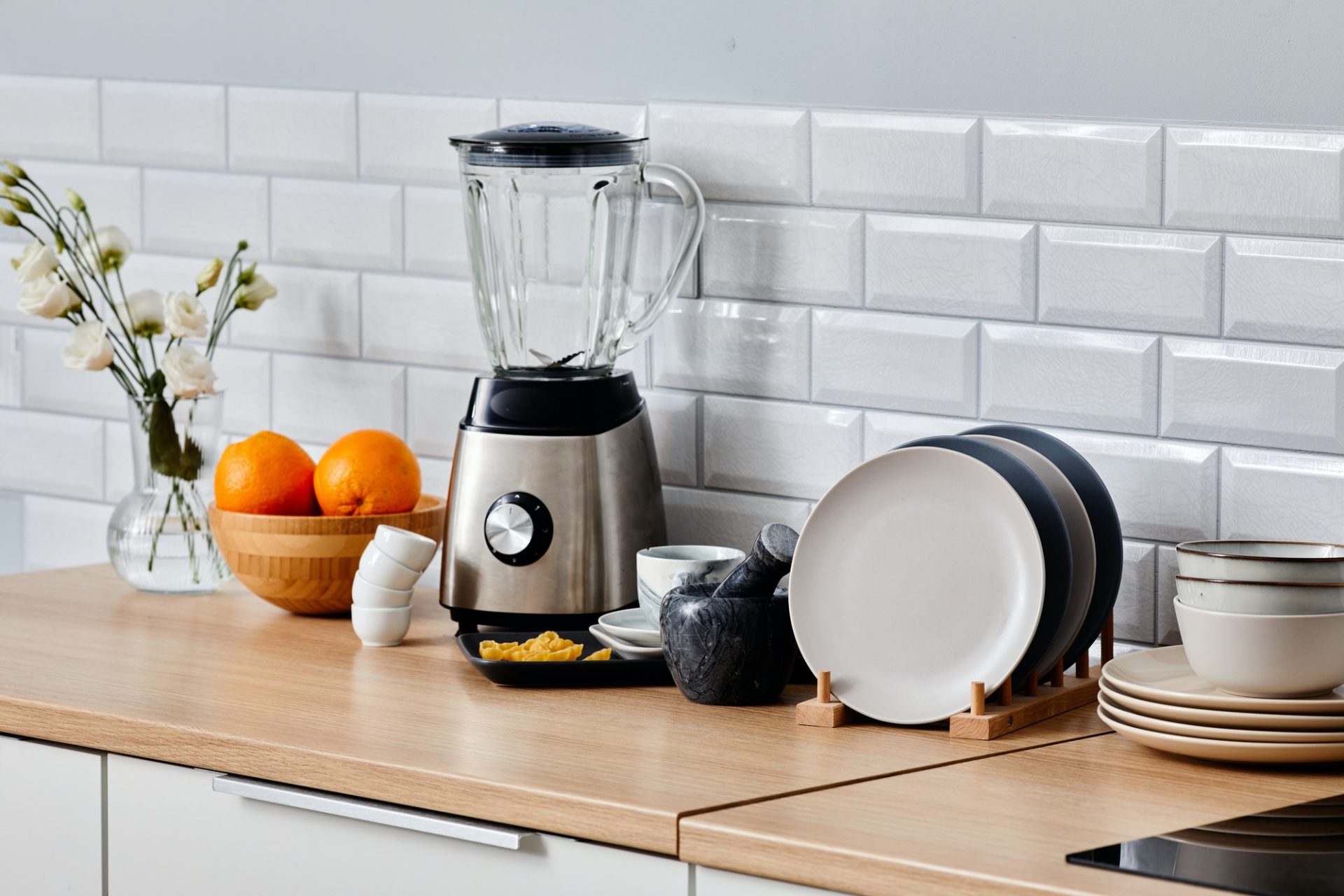 kitchen-appliance-with-crockery-on-table-e1652076355786